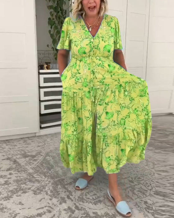 Kjole med korte ermer og lommer og trykk