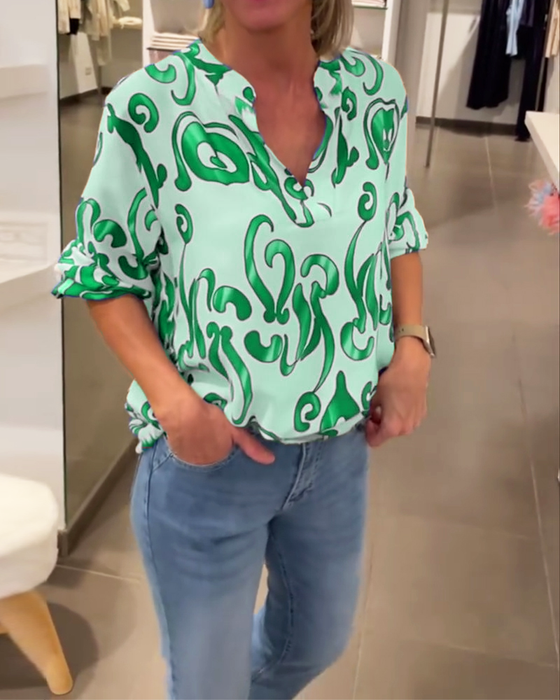 Elegant langermet topp med trykt V-hals