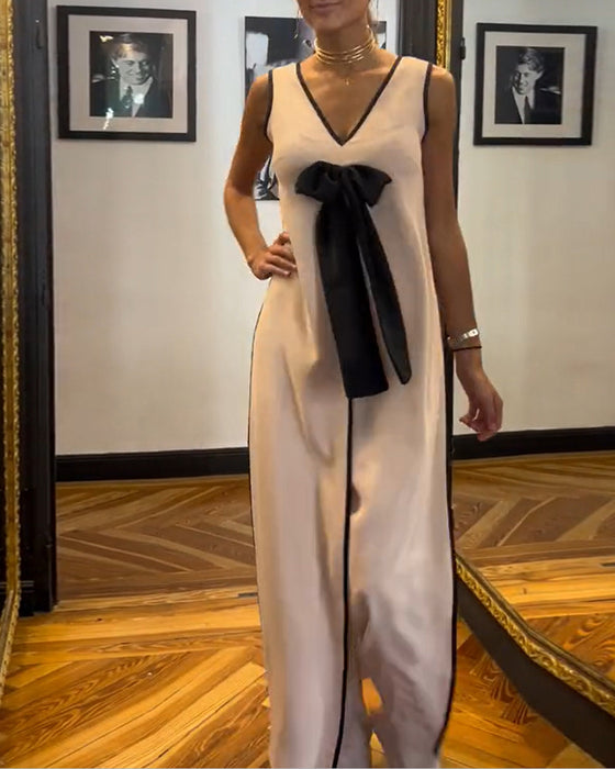 Elegant ensfarget ermeløs sløyfedress