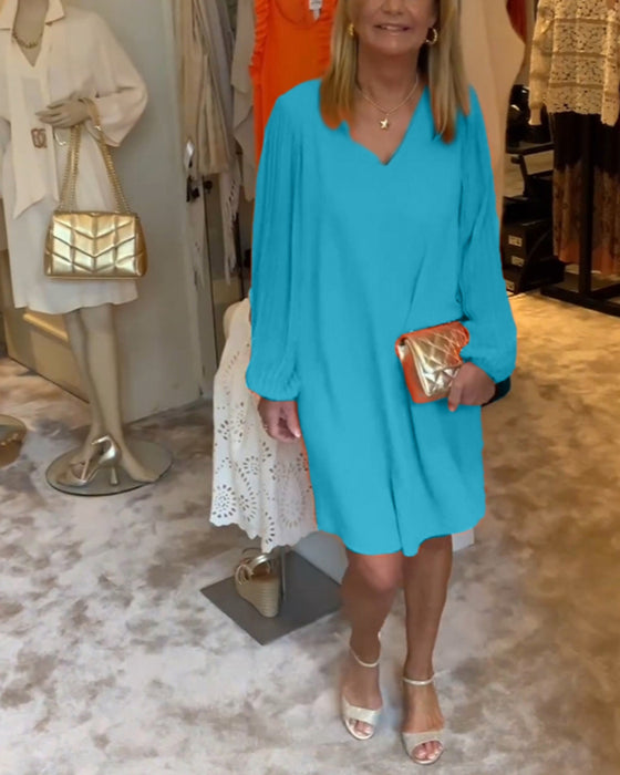 Ensfarget kjole med lanterne med V-hals