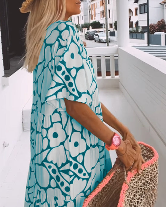 Løs kjole med trykt v-hals