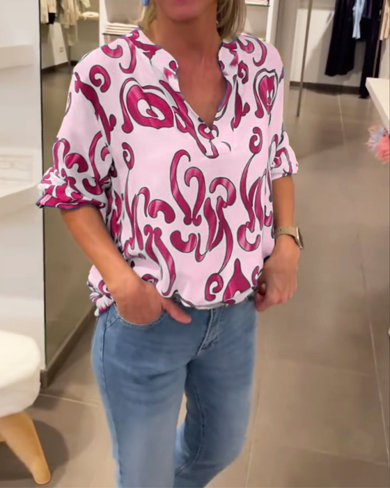 Elegant langermet topp med trykt V-hals