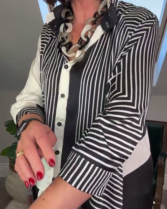 Uregelmessig patchworkskjorte med motetrykt knapp