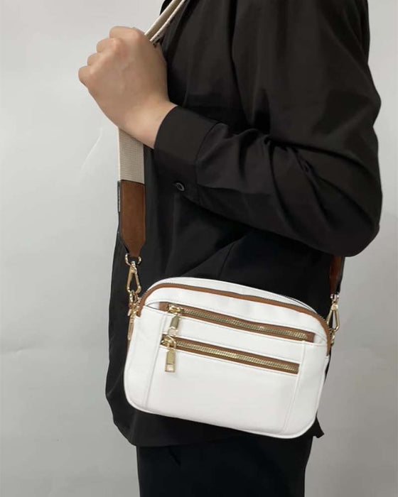 Multifunksjonell crossbody-veske med glidelås