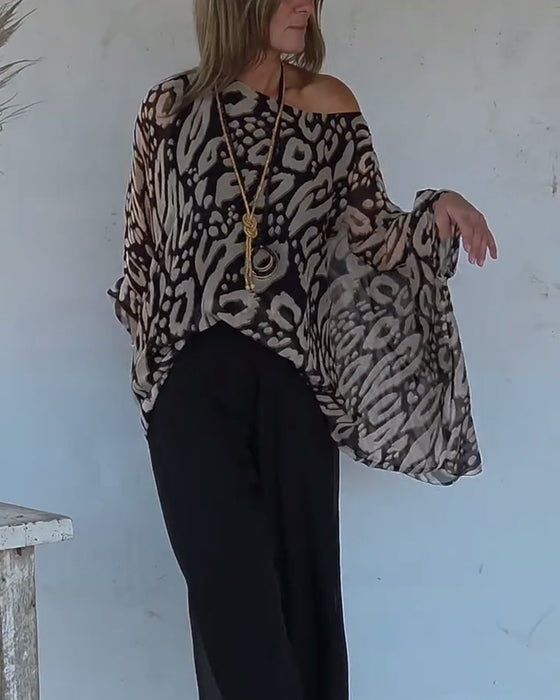 Uregelmessig Bluse Med Flaggermustrykk Og Lange Ermer