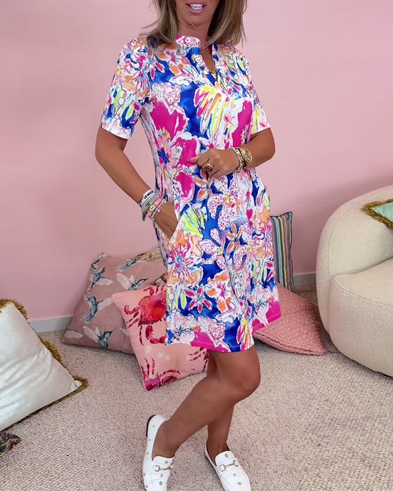 Stilig kjole med lomme med blomstertrykk og korte ermer