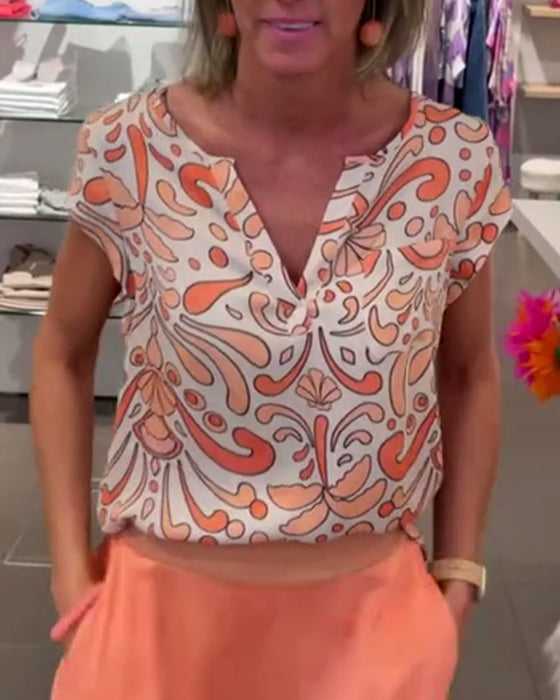 Avslappet bluse med V-hals og raglanermer