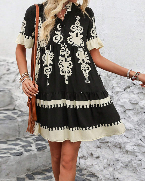Elegant kjole med kortermet trykk med knapper