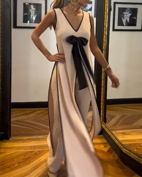 Elegant ensfarget ermeløs sløyfedress