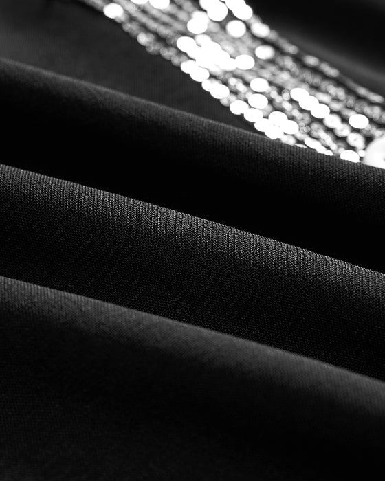 Avslappet topp med panel med paljettknapp