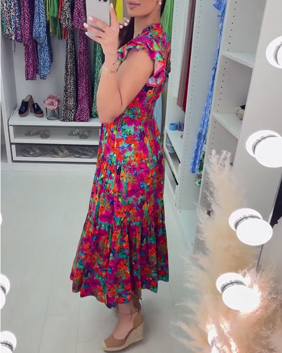 Elegant kjole med V-hals i fargerik blomstertrykk