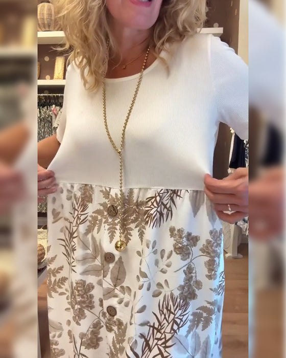 Kjole med avslappet temperament, trykk og rund hals