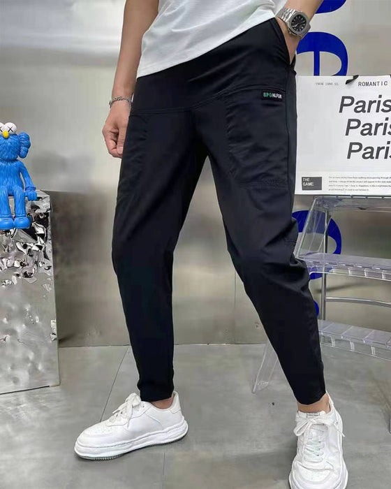 Høystrekkbare skinny cargobukser med flere lommer for menn