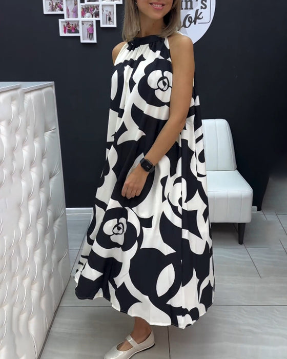 Ermeløs elegant printet kjole