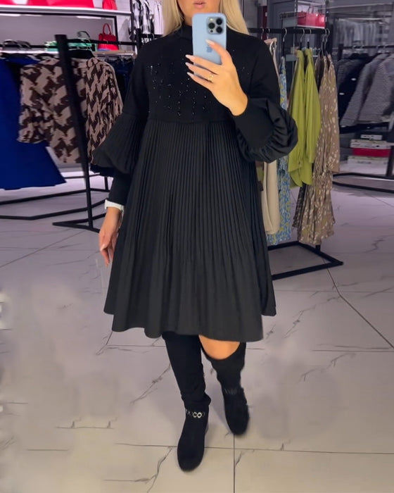 Kjole med ballongermer og ståkrage