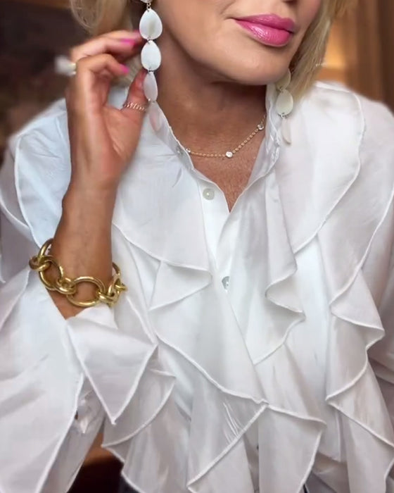 Elegant bluse med ensfarget rysjer