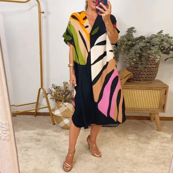 Uformell kjole med fargerik bladtrykk