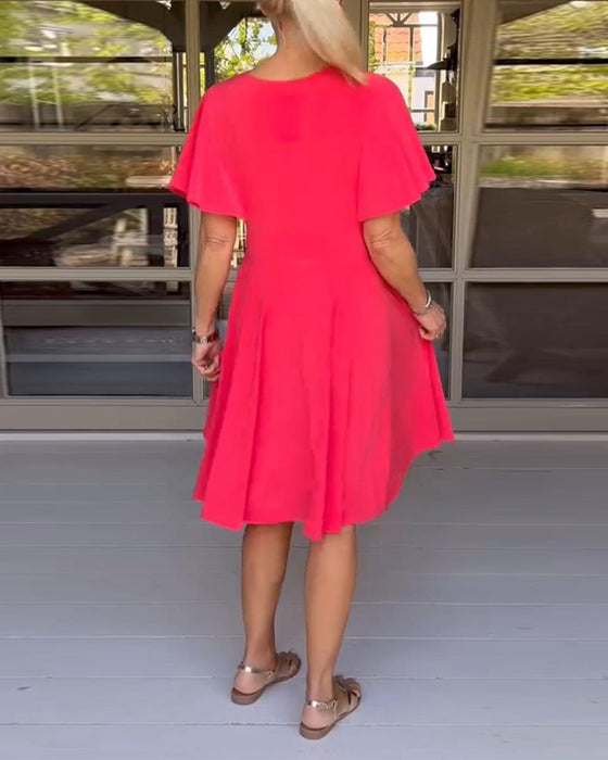 Ensfarget midjekjole med V-hals og sommerfuglerm