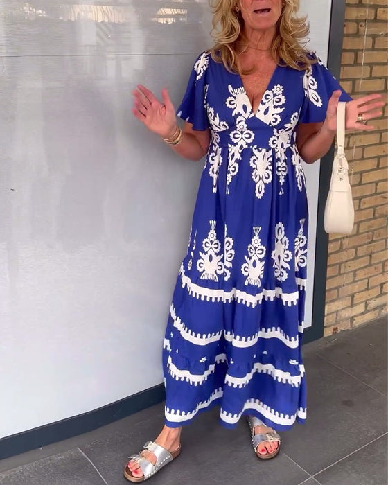 Elegant lang kjole med v-hals med vintage trykk