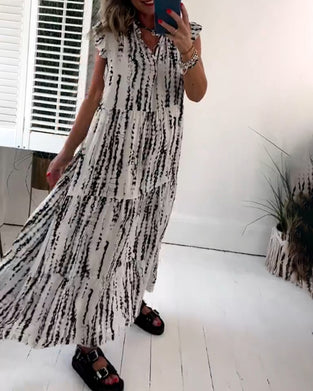 Flueermet kjole med V-hals og blomstertrykk