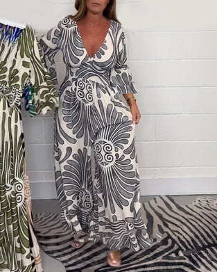 Deep V løs jumpsuit med retroprint og klokkeerm