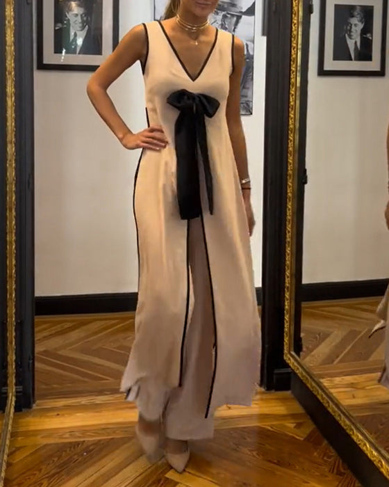 Elegant ensfarget ermeløs sløyfedress