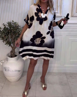 Kjole med trykk og ståkrage