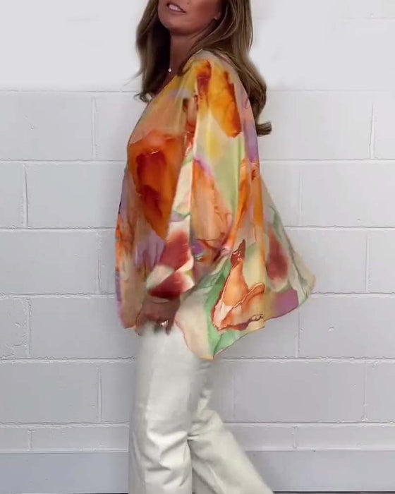 Uformell trykket V-hals bluse med lange ermer