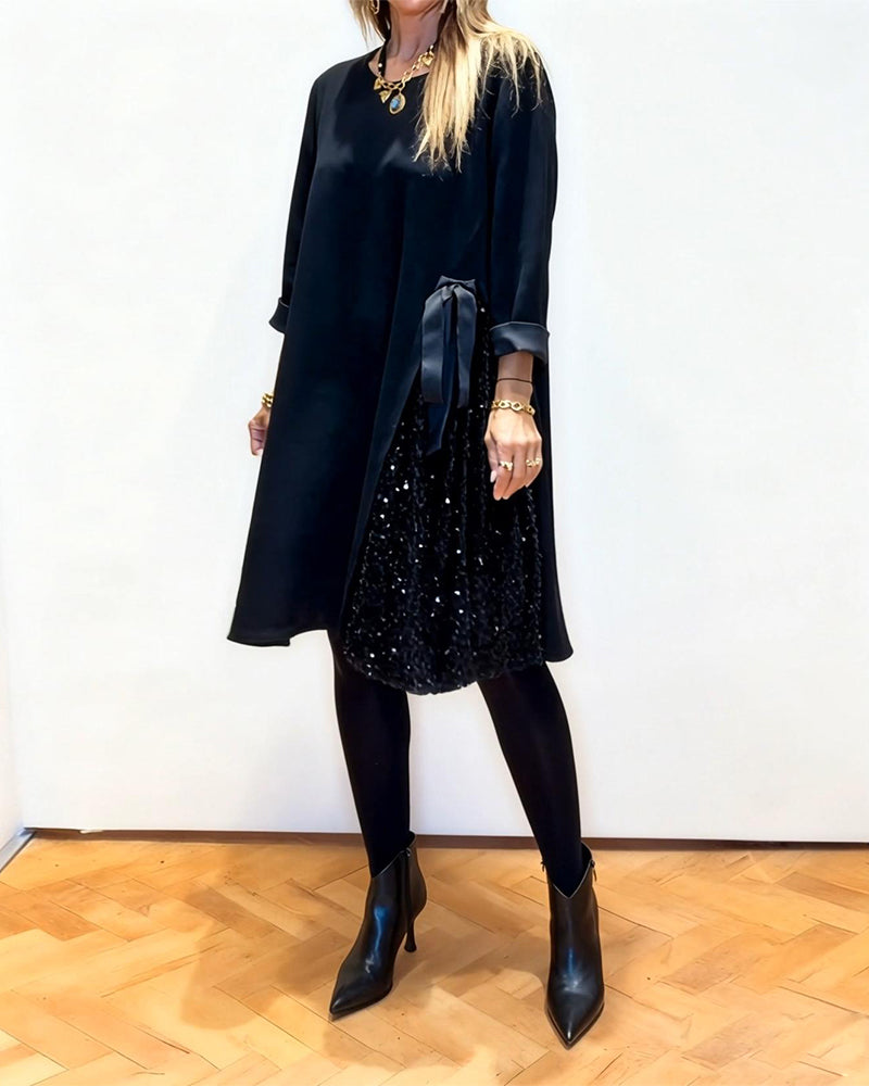 Stilfull Kjole Med Lappetæktsdetaljer Og Rund Hals