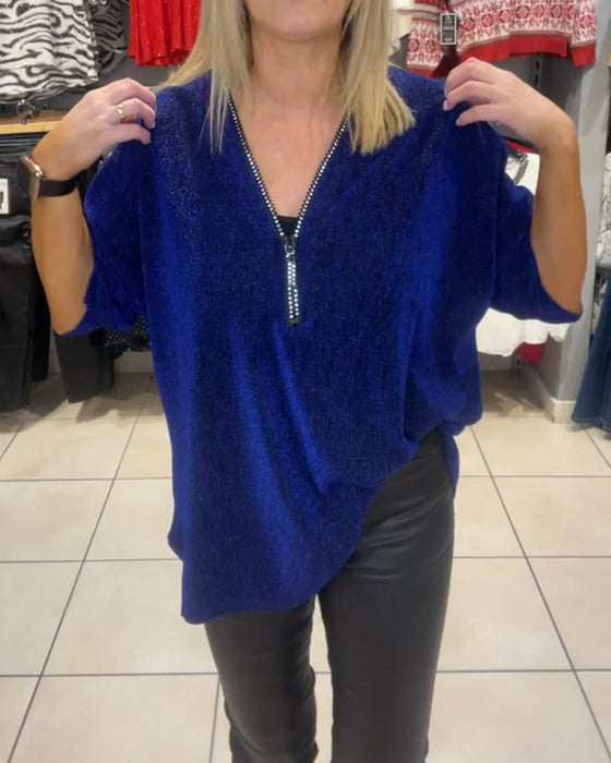 Løs topp med lange ermer og glidelås