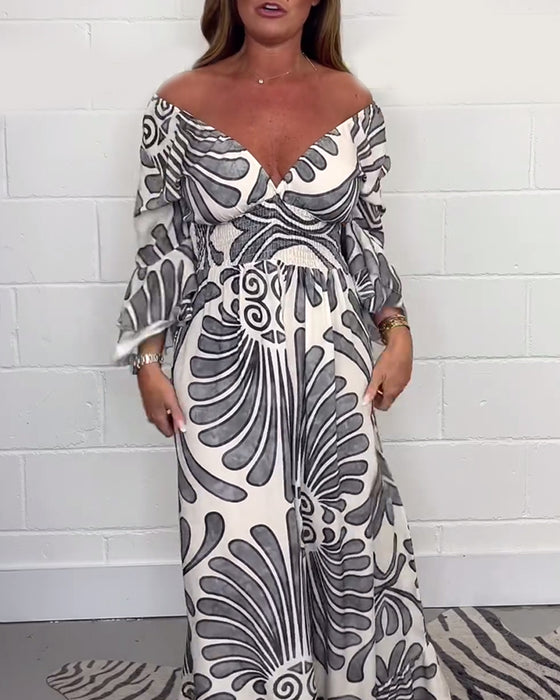 Deep V løs jumpsuit med retroprint og klokkeerm