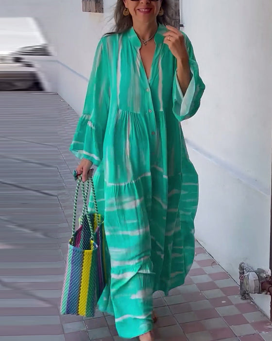 Uformell, løs lang kjole med V-hals og flare ermer