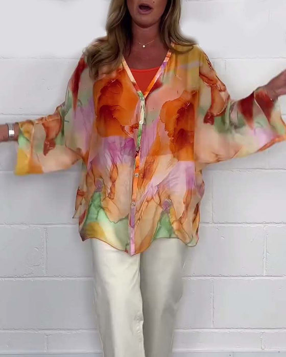 Uformell trykket V-hals bluse med lange ermer