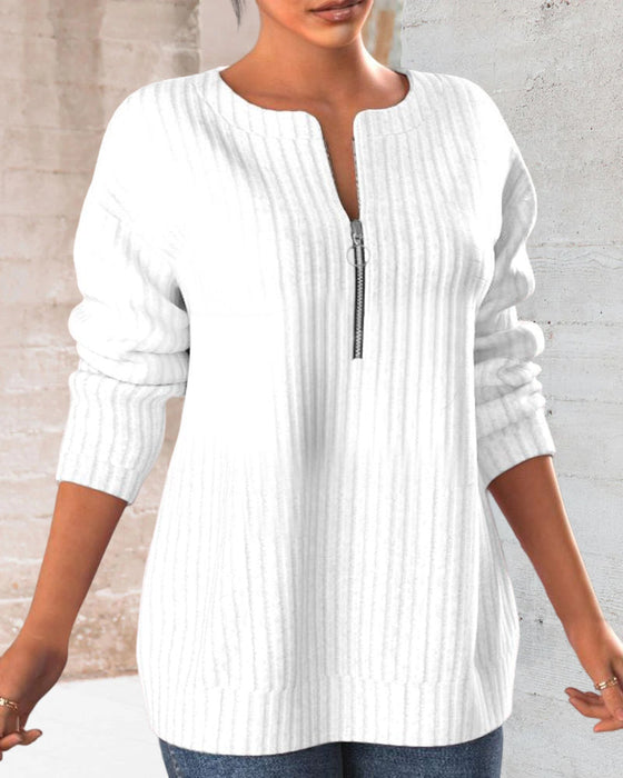 Topp med ensfarget med v-hals med glidelås