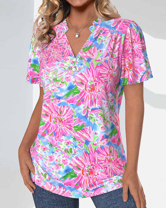 Bluse med korte ermer og blomster og knapper