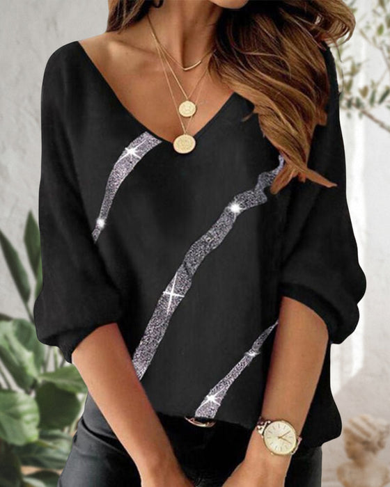 Langermet topp med bokstav- og fjærtrykk