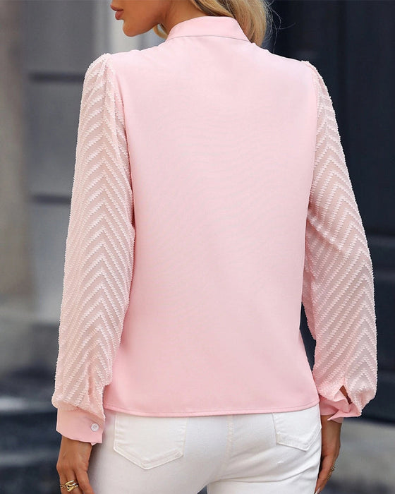 Langermet bluse i ensfarget
