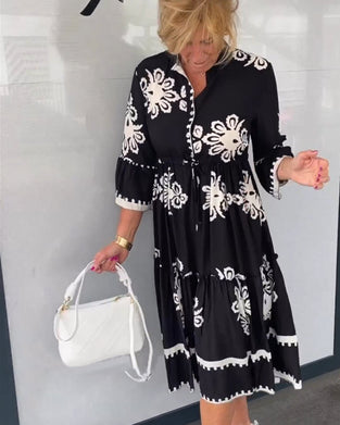 Kjole med blomstertrykk med 3/4-ermer