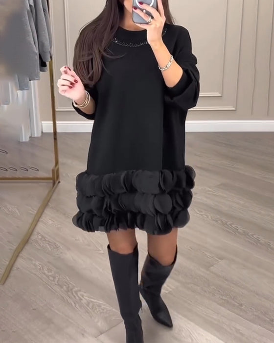 Elegant kjole med patchwork-blader