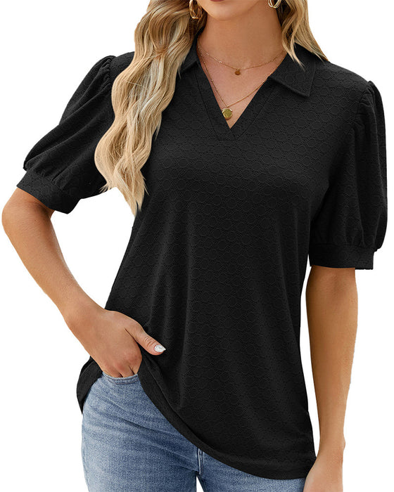 Ensfarget topp med puffermer i jakkeslaget