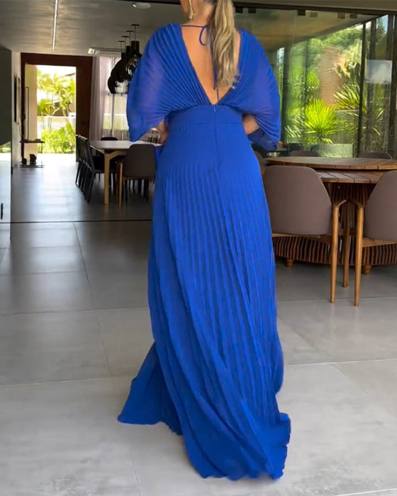 Kjole med folder og nippet midje