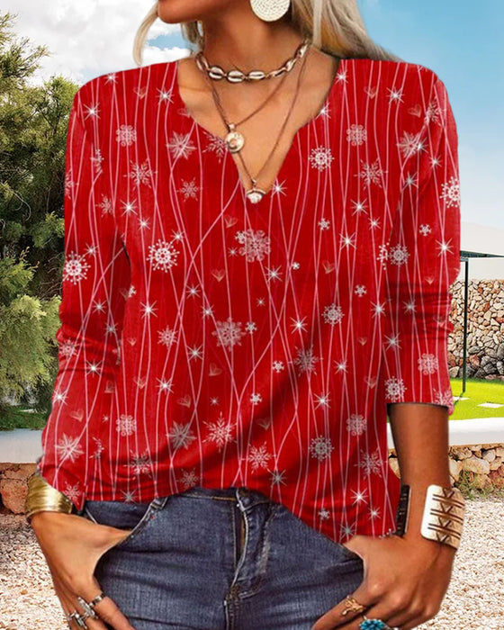 Elegant bluse med V-hals med snøfnugg