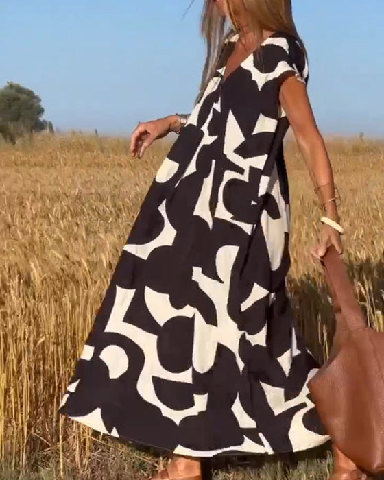 Kjole med trykk og V-hals