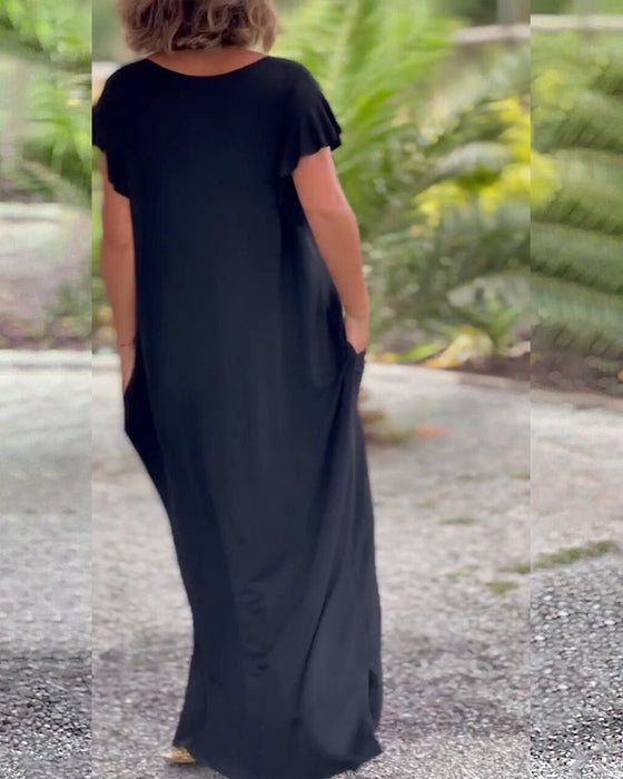 Lang kjole i ensfarget med lomme og kort erme