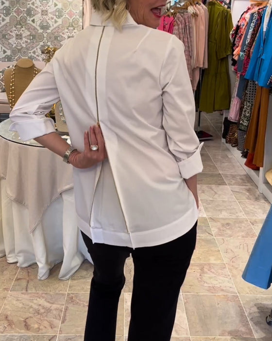 Ensfarget bluse med glidelås