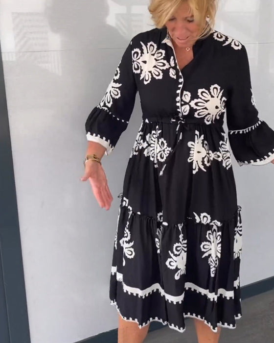 Kjole med blomstertrykk med 3/4-ermer