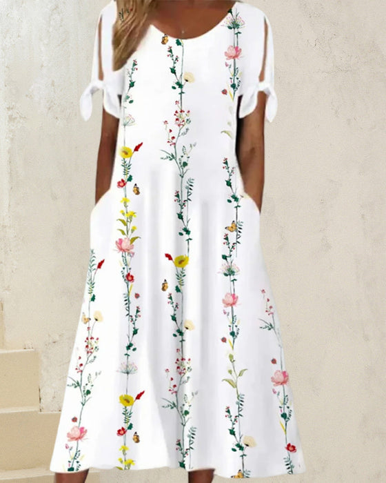 Midikjole med rund hals och blomstertrykk