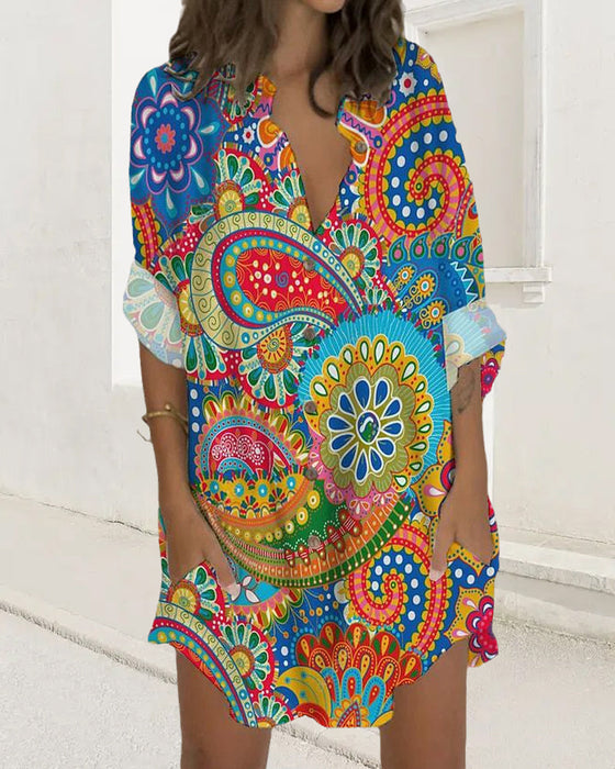 Kneppet kjole med lange ermer og lomme