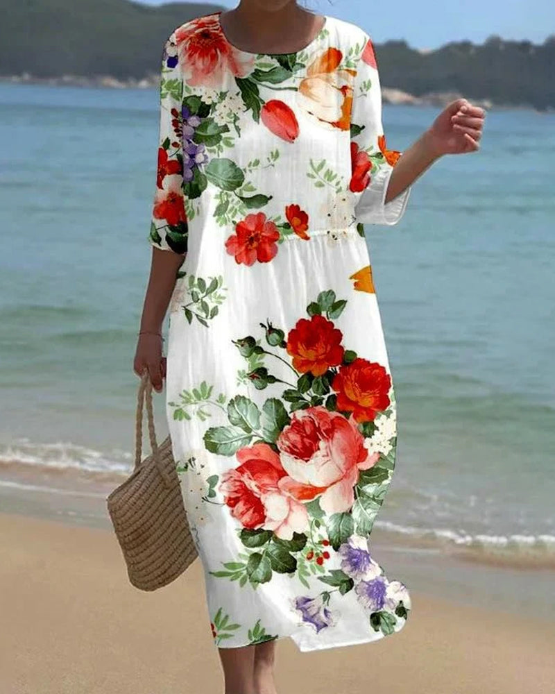 Elegant kjole med rund hals med blomstertrykk
