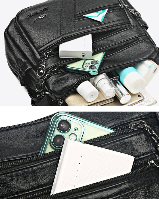 Crossbody-veske i mykt skinn med multilomme